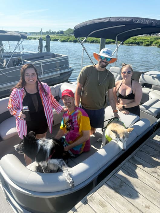 Family enjoying their day on a pontoon in Grand Haven and Spring Lake MI
