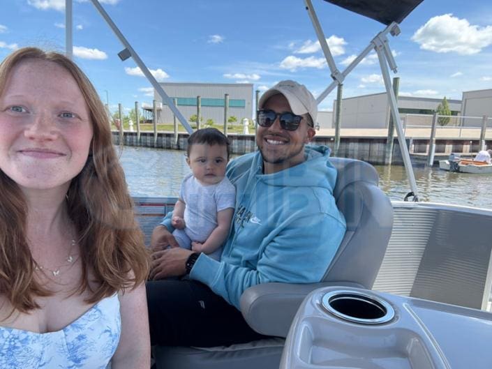 Family enjoying pontoon ride in Grand River